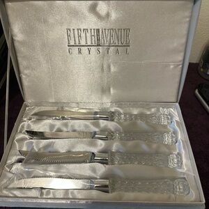 4 steak knives with beautifully crafted crystal handles in a box very elegant